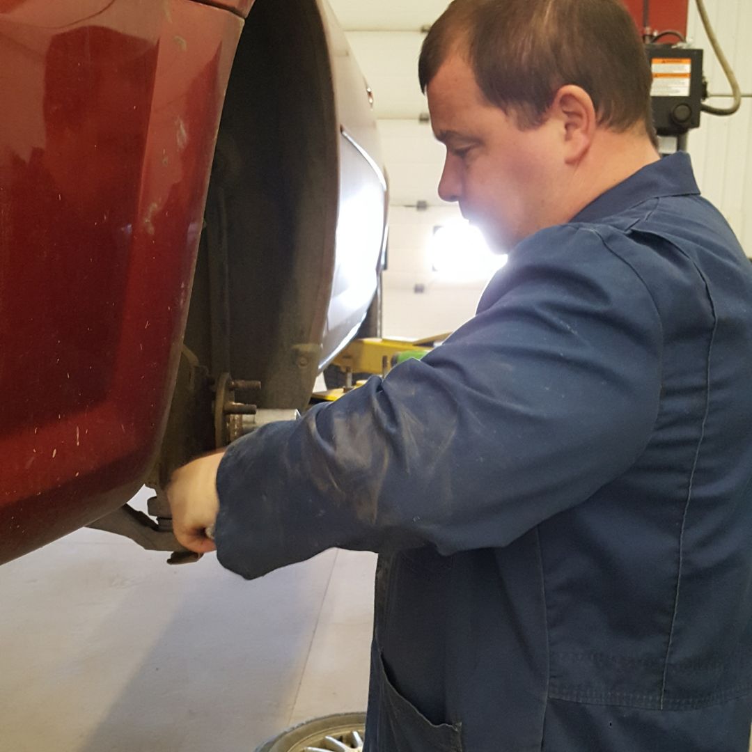Mechanic Working on Brakes in Grande Prairie